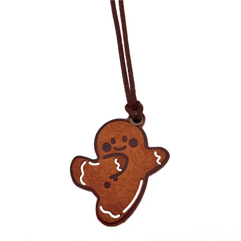 Handmade leather gingerbread man charm – holiday keychain