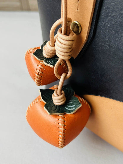 Handmade persimmon keychain – leather lucky charm