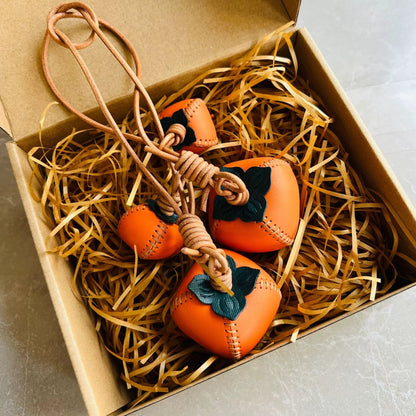 Leather persimmon bag charm – handmade pendant for fortune