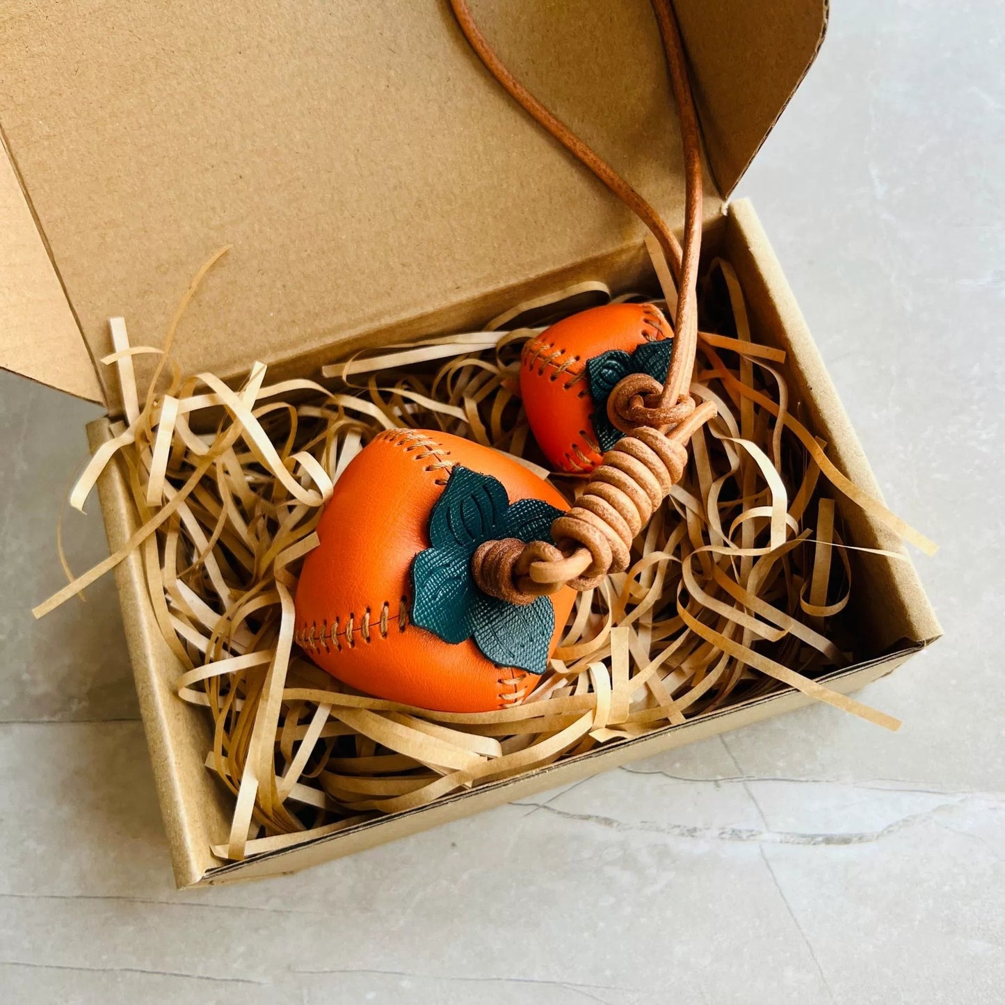 Orange persimmon shaped leather charm – handmade accessory
